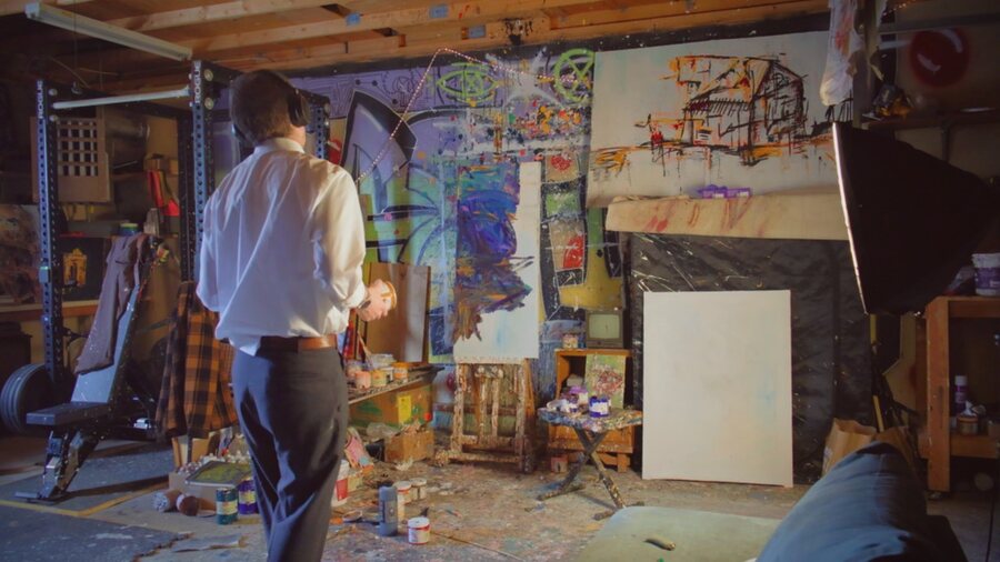 Jake DeBus in the studio with a can of paint